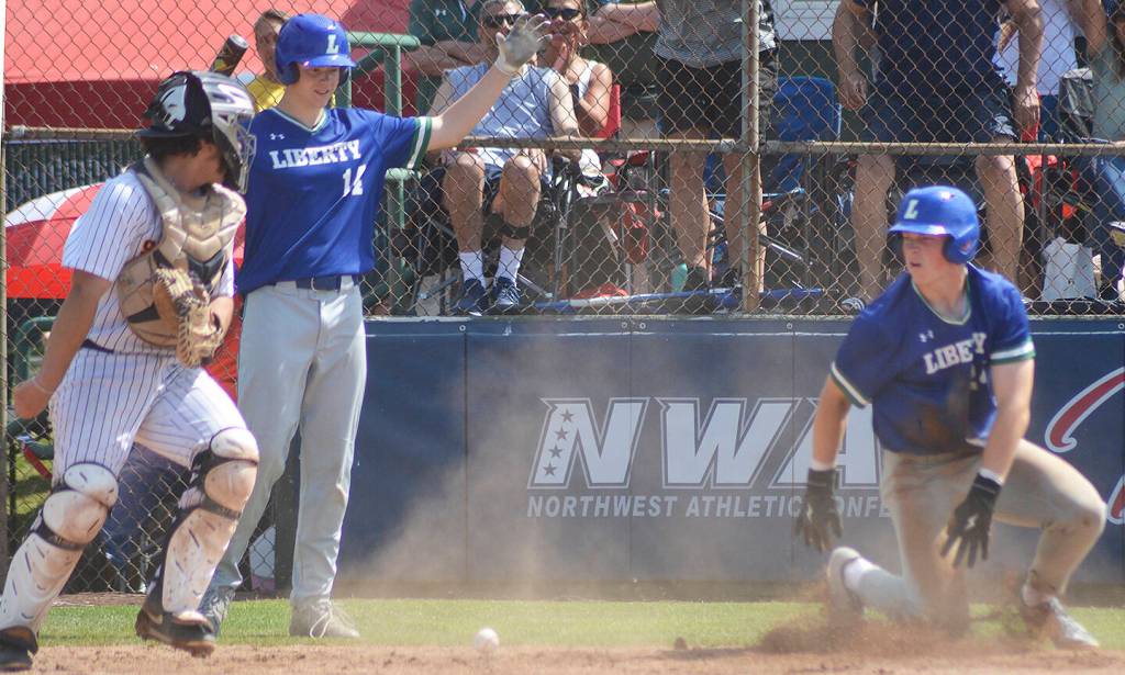 Liberty scores its last run easily at the plate.