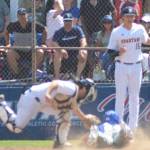 Catcher JT Hardy tags the runner, while Spartan pitcher Cole Pentin backs him up and thinks they got the runner. But the umpire called him safe.