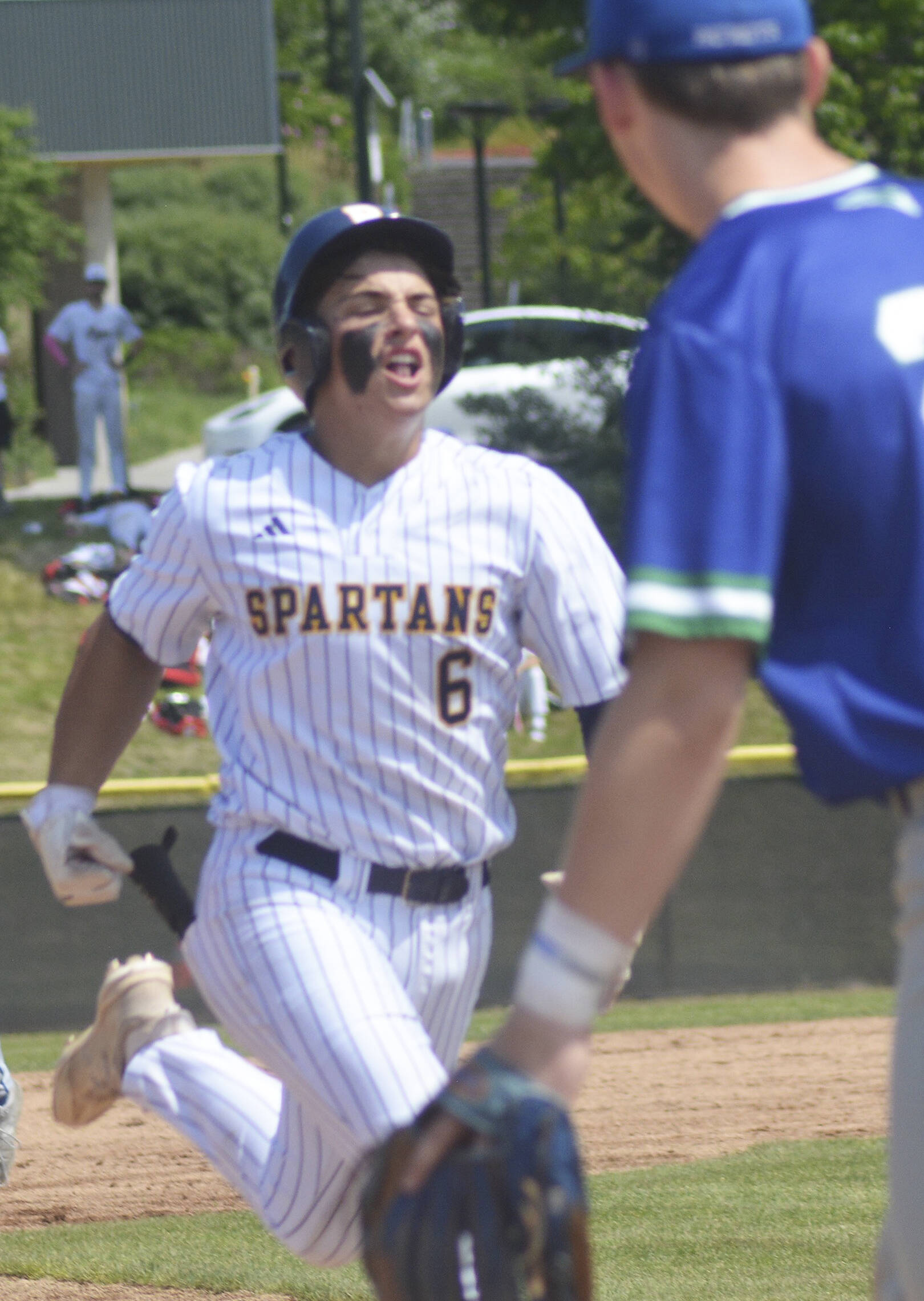 Duncan Bos runs to third base after smashing a triple.