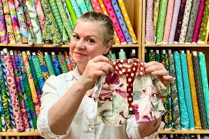 Piper Tupper, owner of Esther's Fabrics on Bainbridge Island, says doll clothes are a great project for beginner sewists. Brenda Jorgens photo