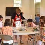 Children in the Bricks 4 Kidz parks department summer camp enjoy creating things with Lego bricks on July 3 in the Fort Ward Community Hall. Nancy Treder/Kitsap News Group Photos