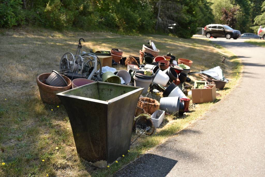 A pile of gardening items is set aside to be picked up at the LOO.