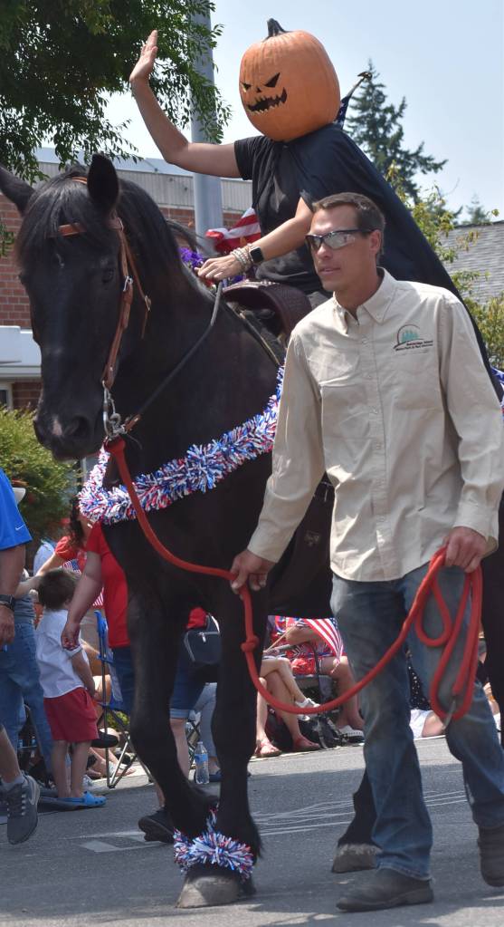 Halloween Head horses around in the parade.