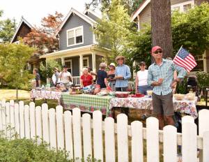 Neighbors on Madison Avenue enjoy lunch before the start on the July 4 parade. Nancy Treder/Kitsap News Group Photos