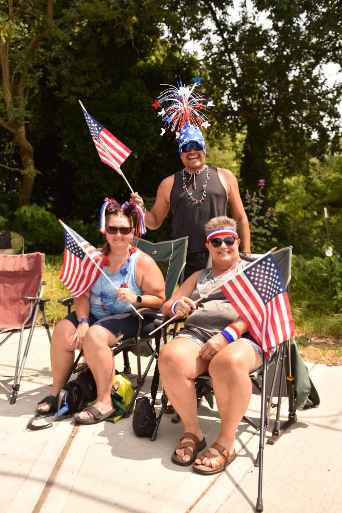 Visitors Gill Edward from Puerto Vallarta, Mexico, with Ann Walters and Lynn Wallum from Kingston visited Bainbridge Island to see the best parade in the Pacific Northwest.