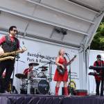 The Soul Siren band plays rhythm and blues on the stage in the Town & County parking lot.