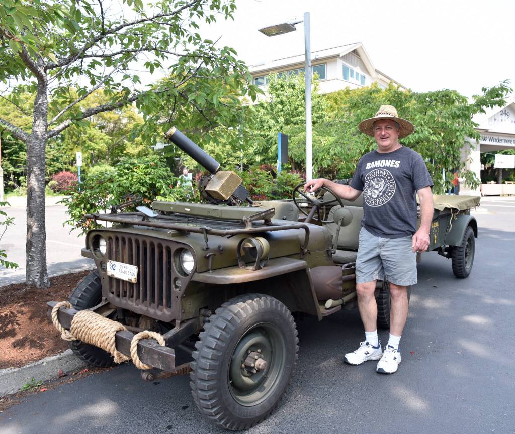 Islander Don Teresi shows off his original 1943 Willys Jeep and 1942 trailer at the car show that he has owned since 1997. It is one of a few dozen operating unrestored jeeps of its kind in the world.
