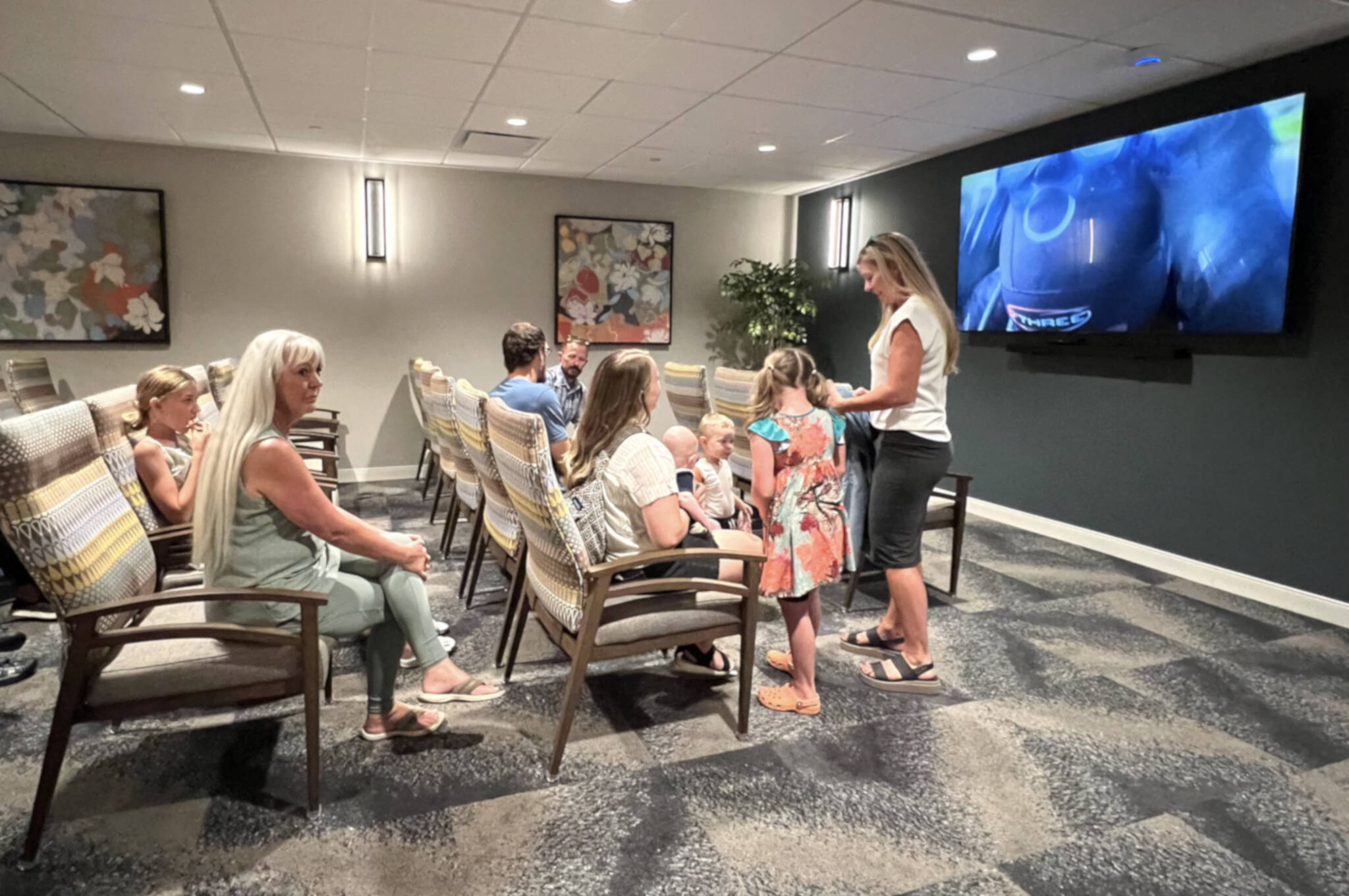 Guests gather in the movie theater for popcorn and entertainment.