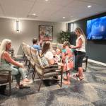 Guests gather in the movie theater for popcorn and entertainment.