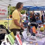 Deb Dahrling, president of PFLAG, talks with visitors about being an ally and speaking up for LGBTQ people.
