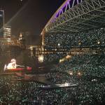 The concert lights up the stadium at night.