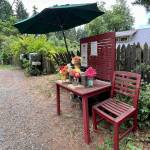A chair awaits visitors at the Finn Hollow Flowers stand on Madison Avenue.