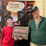 Amateur sleuths Elijah and Doug Treder take a selfie after experiencing the mystery of history in the escape room on Winslow Way.