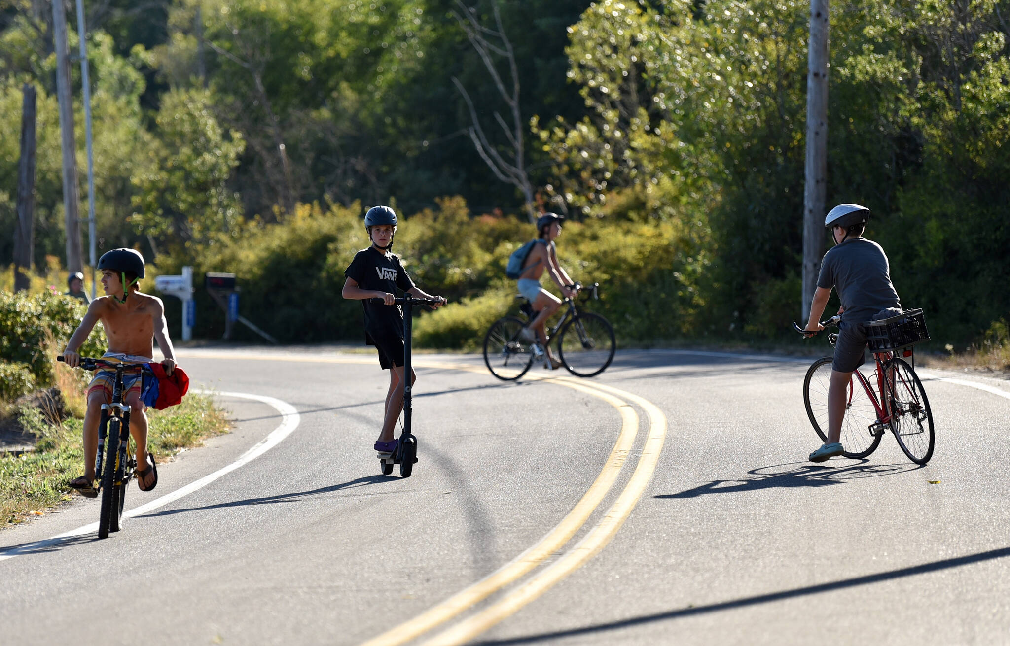 Kids at play on their bikes during summer.