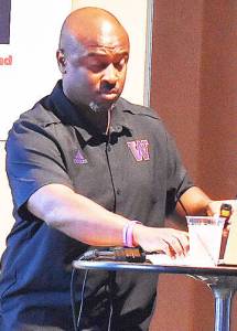 Nicholas Zeller-Singh/Kitsap News Group 
Lee Marks discusses the similarities between his coaching style and Kitsap Athletic Roundtable supporting local youth.