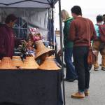 Vendors sell native merchandise and foods to those who attended the event.