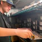 Inspector Nolan Simmons uses a digital thermometer to check the temperature of food to make sure its safe.