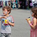 Two kids enjoy some frozen treats on a hot Sunday at the Kitsap Fair.
