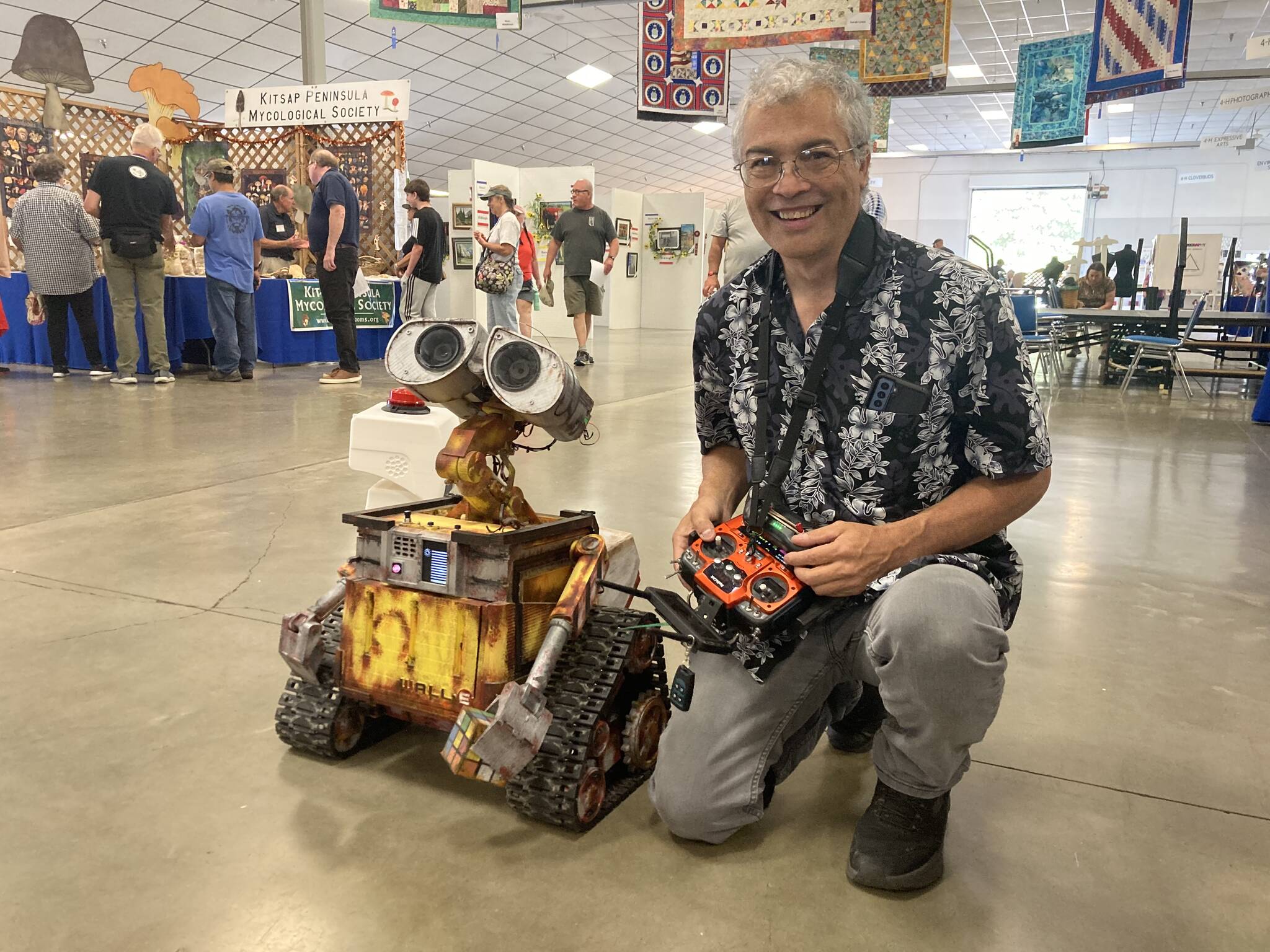 Elisha Meyer/Kitsap News Group
Robert Zollna kneels next to his proud creation, an ultra-realistic WALL-E robot.