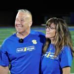 Elisha Meyer/Kitsap News Group Photos
Joe Kennedy puts his arm around his wife Denise while taking late-night questions on the field at Memorial Stadium.