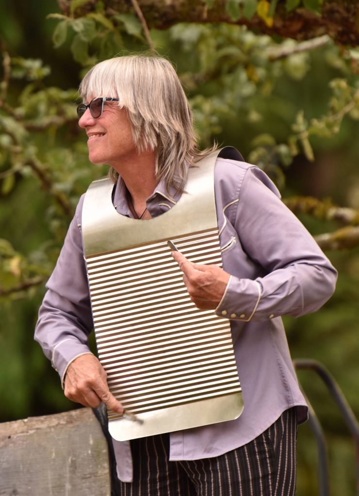 Band member Tami Allen plays a rub board.