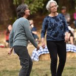 Sisters Johanna Munson and Corey Munson dance to the tunes of the WHOZYAMAMA band.