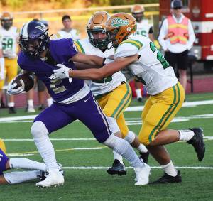 Nicholas Zeller-Singh/Kitsap News Group Photos
NKs Lelond Anderson fights for extra yards before scoring a touchdown.