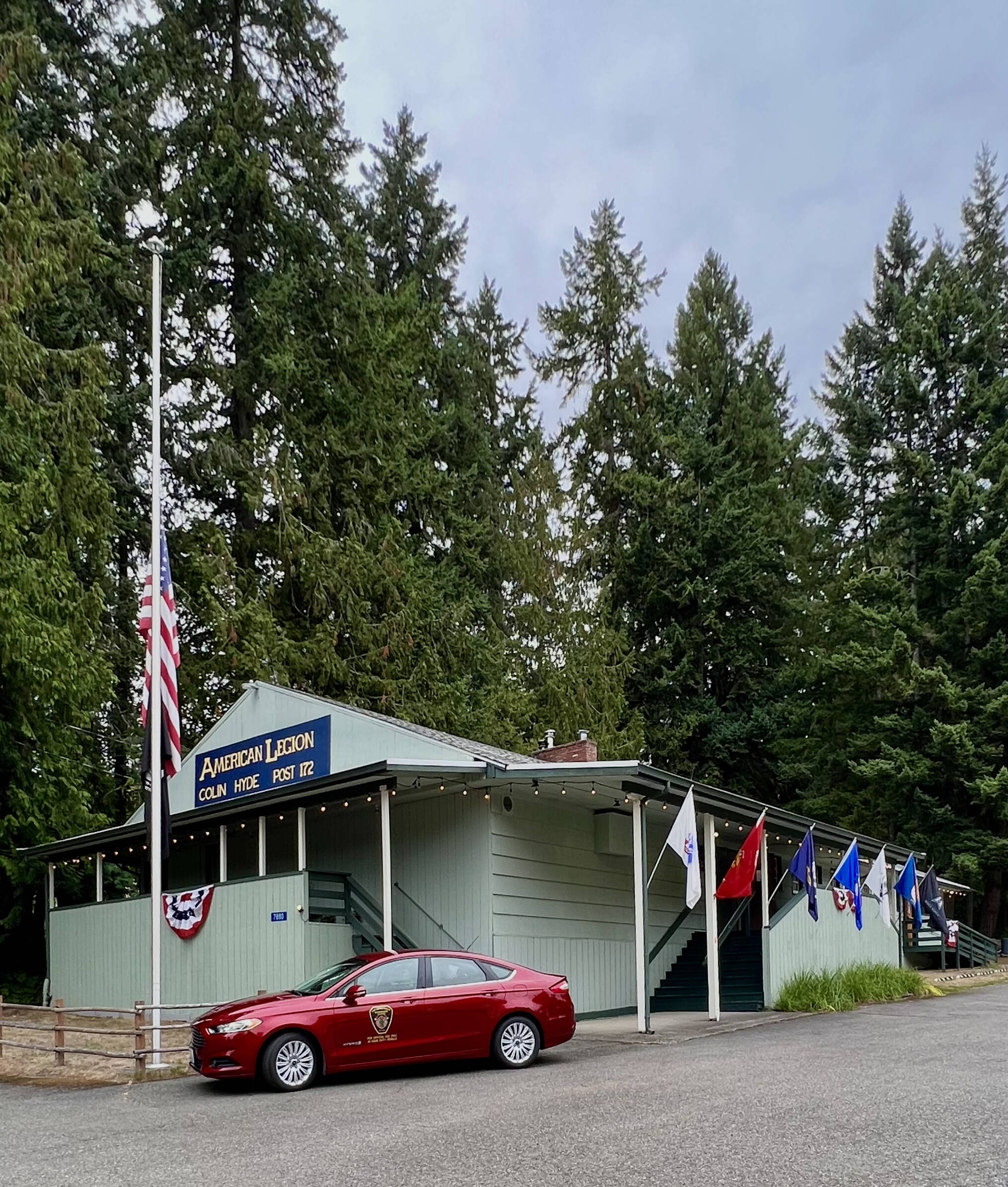 Nancy Treder/Kitsap News Group
The American Legion Colin Hyde Post 172 on Bainbridge Island flew the American flag at half-staff to commemorate Patriot Day in honor of the first responders and civilians who died or were wounded on Sept. 11, 2001, and the POW/MIA flag for military personnel who were prisoners of war or missing in action.