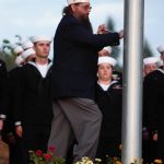VFW Post 239 Cmdr. John Gifford raises the flag.