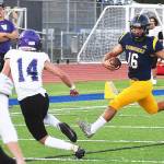 Jack Grant scrambles for a touchdown against Sequim.