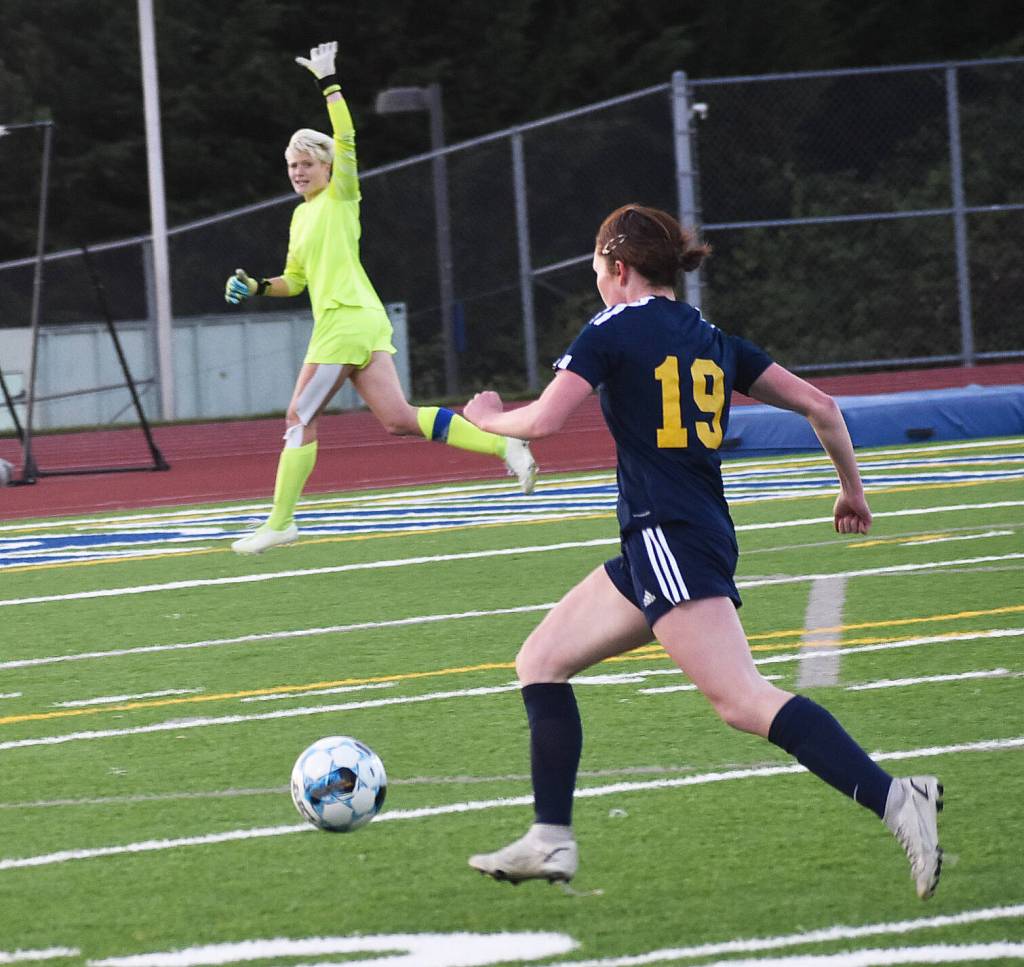 Bainbridgess Avery Pujolar dribbles down the sideline before scoring.