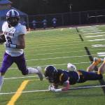 Nicholas Zeller-Singh/Kitsap News Group Photos
Viking Logan Sloman evades defenders and scores a touchdown.