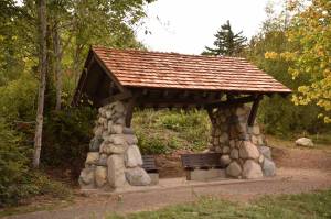 Nancy Treder/Kitsap News Group Photos
A new covered memorial shelter overlooking Eagle Harbor was installed at Pritchard Park privately funded by the Parsons family, in honor of their daughter Carrie and other families who have prematurely lost their children. The new rock-and-timber bench shelter sits on the bluff overlooking the mouth of Eagle Harbor with a view of the Seattle skyline was designed by Dan Hamlin and David Harry, Bainbridge Metro Parks superintendent.