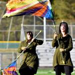 Color Guard members swing colorful flags to enhance the visual effect of the overall performance of the BHS Marching Band.