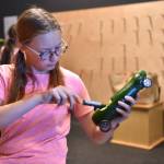 Nancy Treder/Kitsap News Group Photos
Bainbridge sophomore Cadence Hill carves out the center of a zucchini to enter in the Great Zucchini Race.