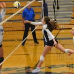 Nicholas Zeller-Singh/Kitsap News Group Photos 
Spartan Cate Torrell tips the ball over the net for a point.