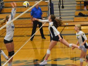 Nicholas Zeller-Singh/Kitsap News Group Photos 
Spartan Cate Torrell tips the ball over the net for a point.