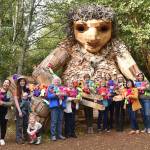 Women from the Church of Latter-Day Saints on Bainbridge Island gathered at Pia the Peacekeeper troll to take a photo of all the teddy bears they made for children.