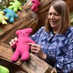 Nancy Treder/Kitsap News Group Photos
April Dever holds one of the teddy bears her group made for Dolls of Hope, a project that gives teddy bears to children in areas of crisis around the world.