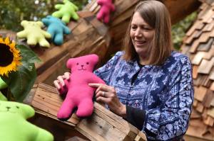 Nancy Treder/Kitsap News Group Photos
April Dever holds one of the teddy bears her group made for Dolls of Hope, a project that gives teddy bears to children in areas of crisis around the world.