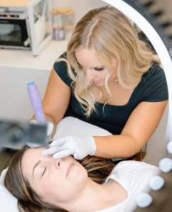 Brianna Madison courtesy photo
A mirror reflection shows Brianna Madison (top) working with a customer.