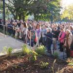 Damon Williams/Kitsap News Group Photos
Bainbridge Island City Councilmember Clarence Moriwaki talks to the hundreds of people who attended the recent grand opening of the newly remodeled Bainbridge Performing Arts Center.