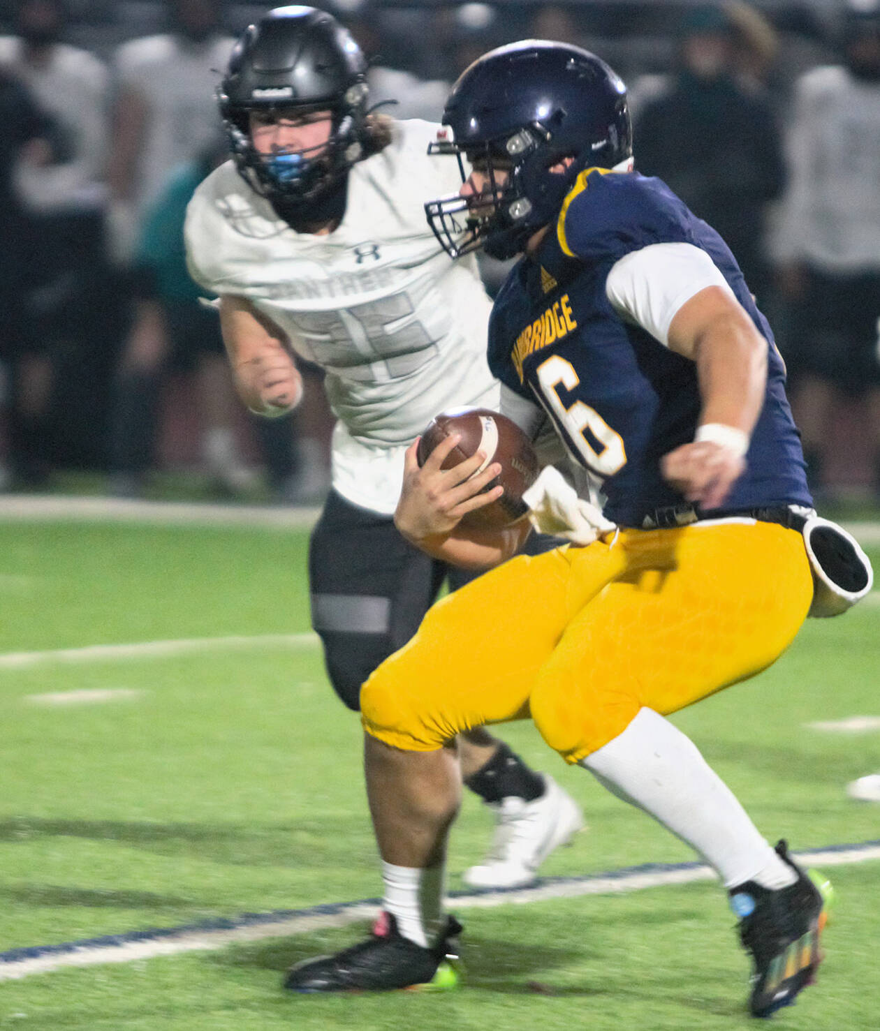 Bainbridge quarterback Jack Grant scrambles down the field for a huge gain during the Spartans clutch fourth-quarter drive.