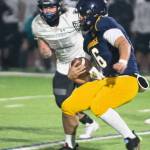 Bainbridge quarterback Jack Grant scrambles down the field for a huge gain during the Spartans clutch fourth-quarter drive.