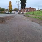 Elisha Meyer/Kitsap News Group Photos
This stretch of sidewalk on Dr. Martin Luther King Way is clear for the first time in months, signs of what was there before the Nov. 4 cleanup still implanted in the ground.