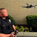 Mike De Felice/Kitsap News Group Photos
Sgt. Trey Holden launches one of the crime-fighting drones, which can go places officers cant because of the danger involved.