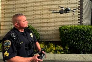 Mike De Felice/Kitsap News Group Photos
Sgt. Trey Holden launches one of the crime-fighting drones, which can go places officers cant because of the danger involved.