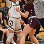 Islander Caitlin Monahan pokes the ball from Spartan Bella Ramirez.
