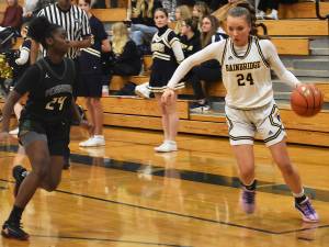 Nicholas Zeller-Singh/Kitsap News Group Photos
Bella Ramirez drives past Peninsulas Grace Richardson.