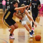 Sam Nylund drives past the Sequim defender.